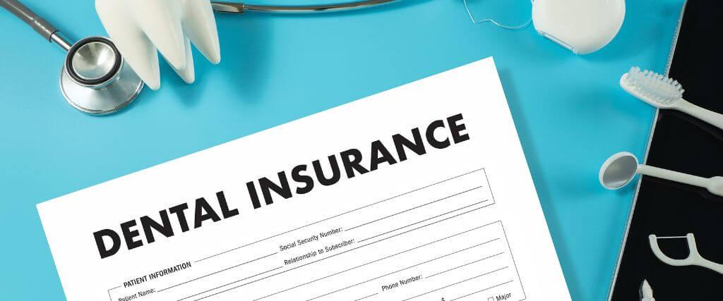 Understanding Dental Insurance: Coverage, Costs, and What Patients Need to Know Dental insurance form on a clipboard surrounded by dental tools